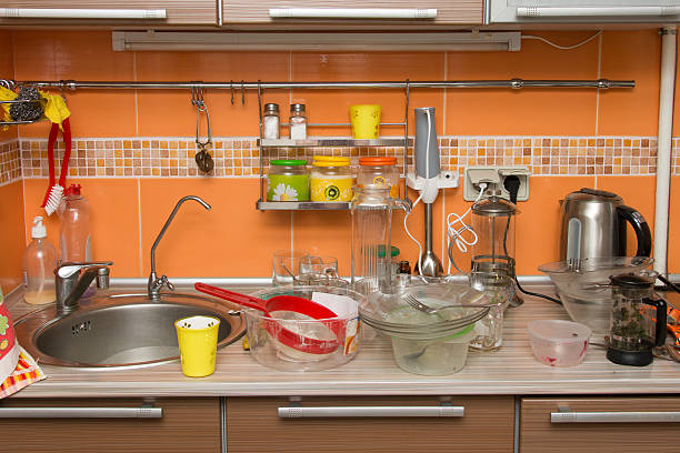 istock pile of dirty dishes in the kitchen 579221780