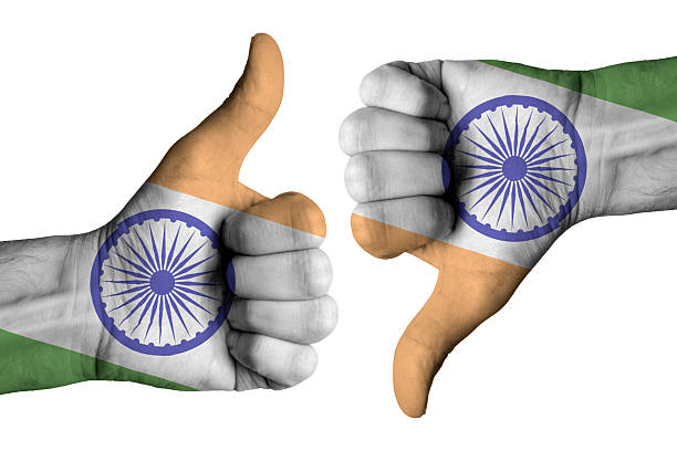 istock India flag on human male thumb up and down hands 579222796