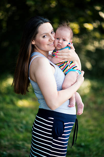 istock Mother with baby in the park 579222914