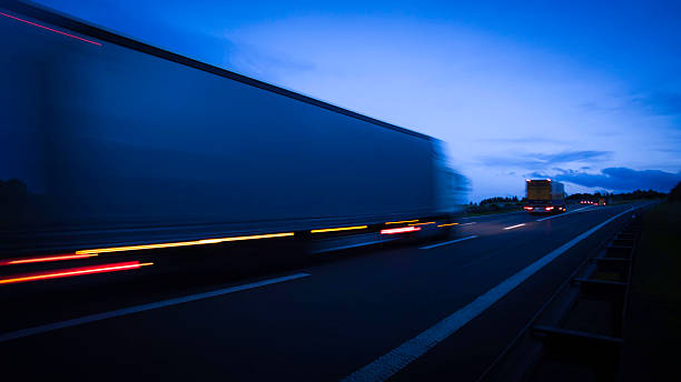 istock night on the road: blurred cars on a highway 579224140