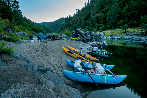 Boat camping at dusk on the Rogue River, Rogue River Wild and Scenic Wilderness, Oregon.