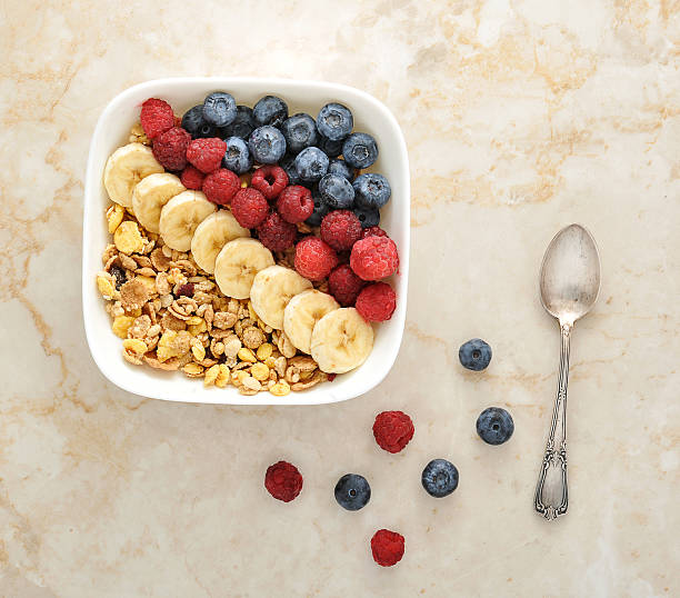 istock healthy Breakfast - cereal with blueberries, raspberries and ban 579230046