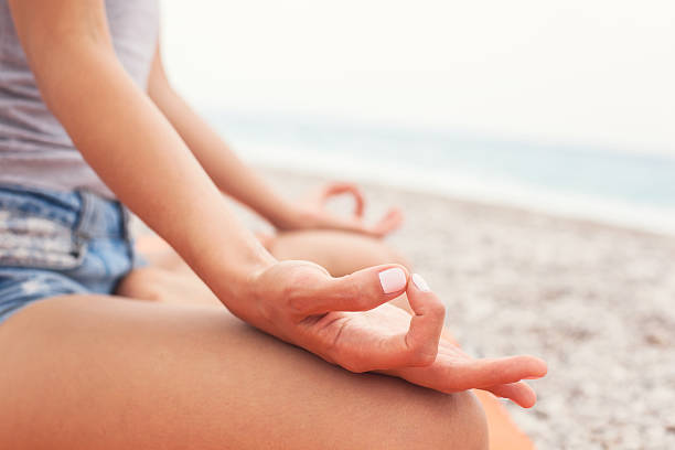 istock Meditating. Woman doing yoga. Close-up 579230752