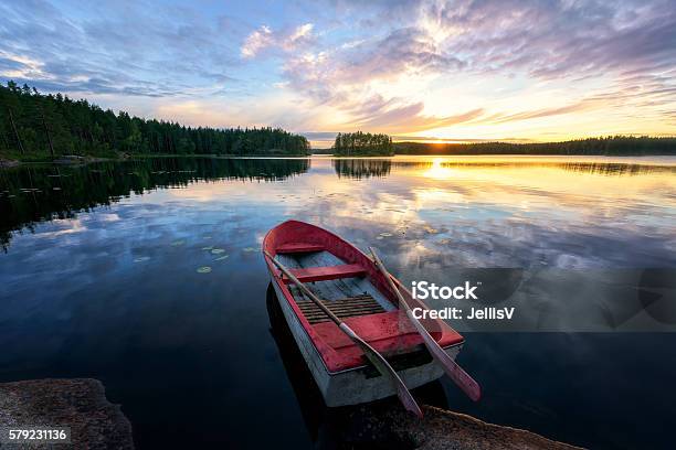 Rowboat With Stunning Sunset Stock Photo - Download Image Now - Lake, Rowboat, Nautical Vessel