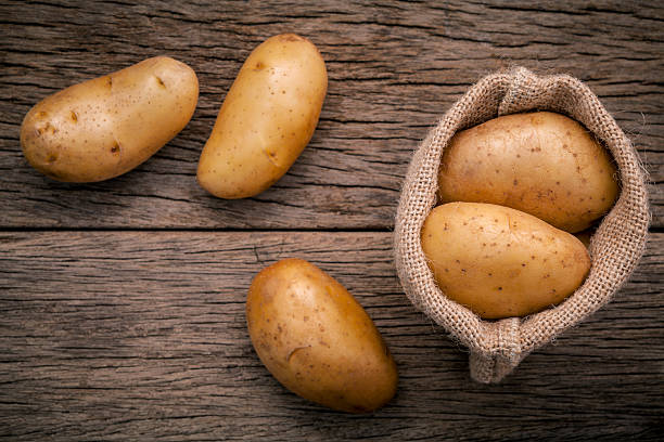 istock Fresh organic potatoes in hemp sake bag . 579233486