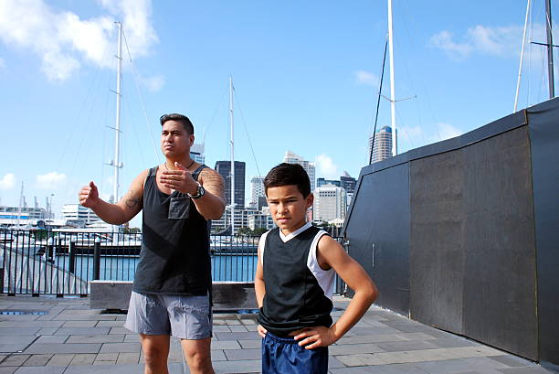 istock Pacific Island Man and Boy in Urban Scene 579233688