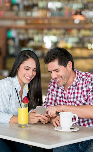istock Couple having a cup of coffee and social networking 579235868