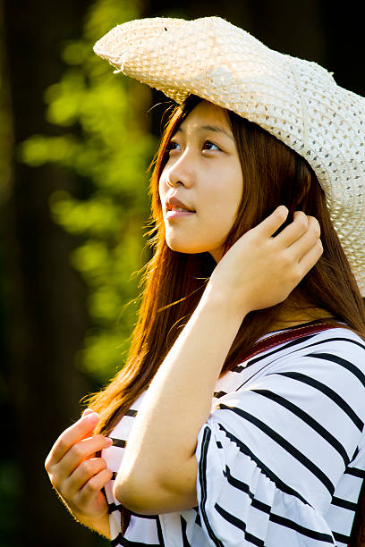 istock Asian beautiful girl look up 579236544