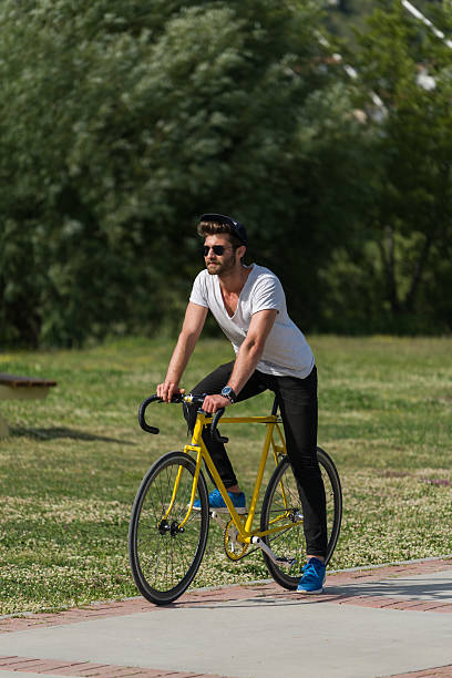 istock Handsome boy ride a bike 579237320