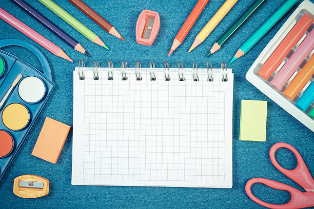 istock School and office supplies on jeans background, back to school 579239400