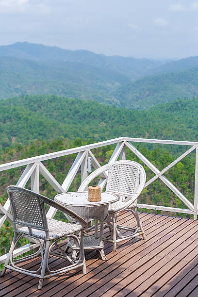 istock rattan chair on balcony with beautiful mountain view 579239964