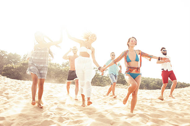 istock Young people having fun and dancing on the beach 579241584