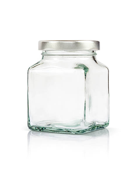 istock Clear glass bottle with silver cap isolated on white 579243280