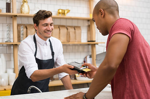 istock Customer paying with credit card 579250458