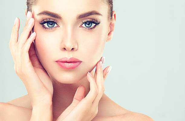 Portrait of young woman with clean fresh skin. stock photo