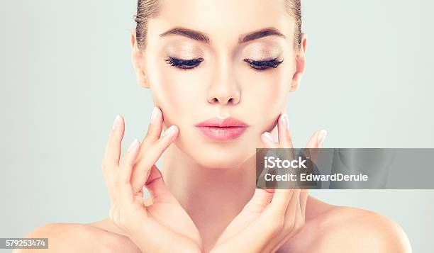 Portrait Of Young Woman With Clean Fresh Skin Stock Photo - Download Image Now - Women, Anti Aging, Adult
