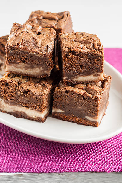 istock marble chocolate brownies with mascarpone are stacked on a plate 579253666