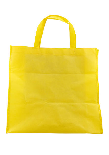 istock yellow fabric bag isolated on white background 579254130
