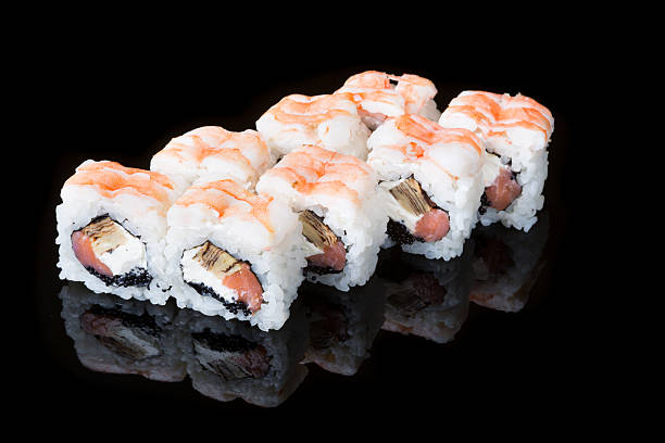 istock Japanese rolls on black background i 579255494