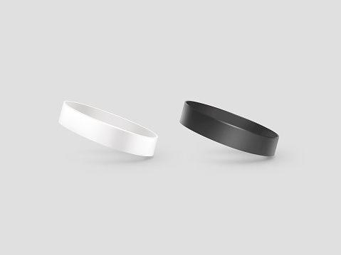 Blank white and black rubber wristband mockup, clipping path, 3d illustration. Clear sweat band mock up design. Sport sweatband template. Silicone fashion round social bracelet. Unity band.