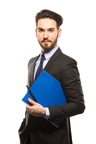 istock Young handsome man in black suit and folder smiling isolated 579259996