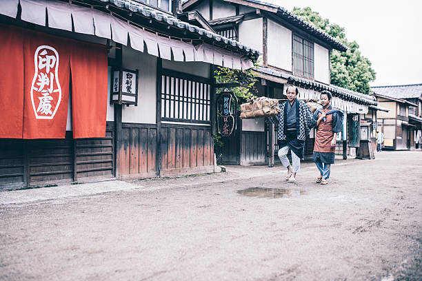 istock Trader with his son in ancient Japanese town 579261034