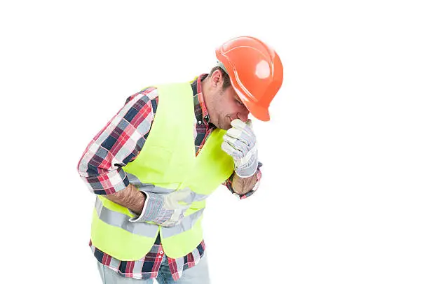 Photo of Builder with stomach problem is about to vomit