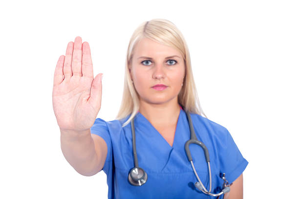 istock Woman doctor with stethoscope doing stop gesture as prevention concept 579400654