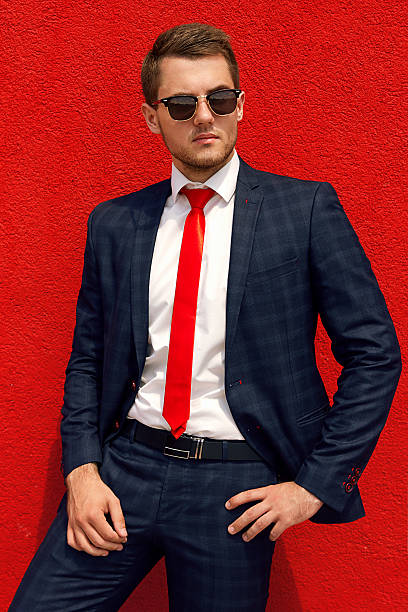 istock model businessman in a blue suit and tie 579403384