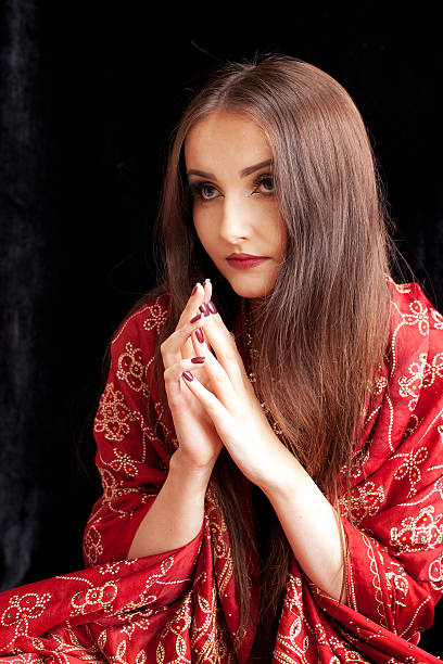 istock Beautiful Indian woman praying 579403750
