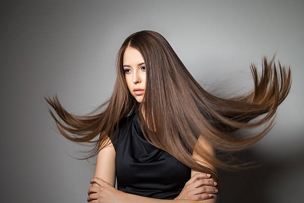 istock Beautiful model with smooth flying hair 579406338
