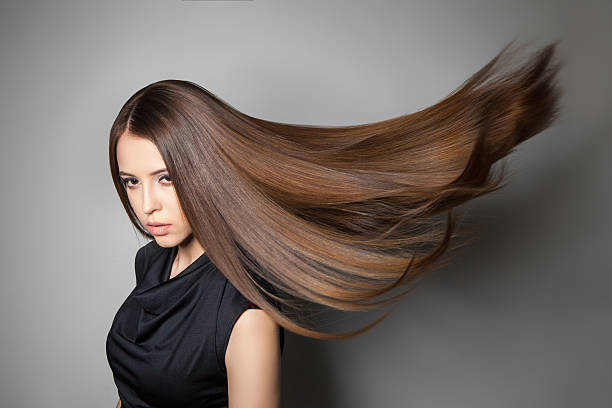 istock Beautiful model with smooth flying hair 579406502