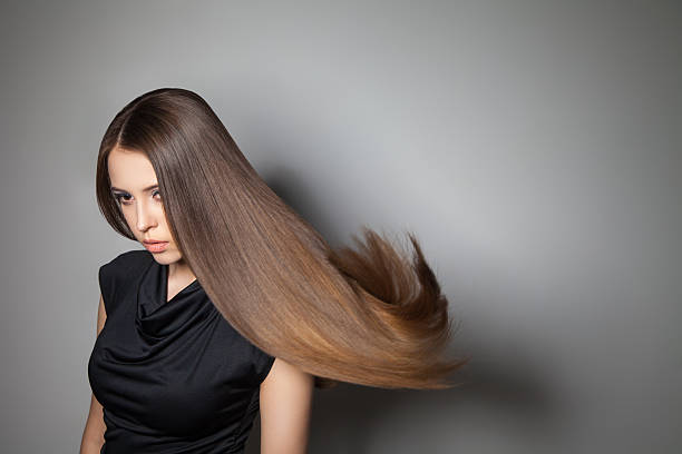 istock Beautiful model with smooth flying hair 579406808
