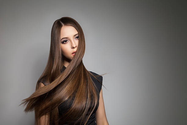istock Brunette model with brilliant hair flying away 579407262