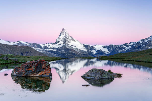 Matterhorn at sunrise with Stellisee in foreground Matterhorn at sunrise matterhorn stock pictures, royalty-free photos & images