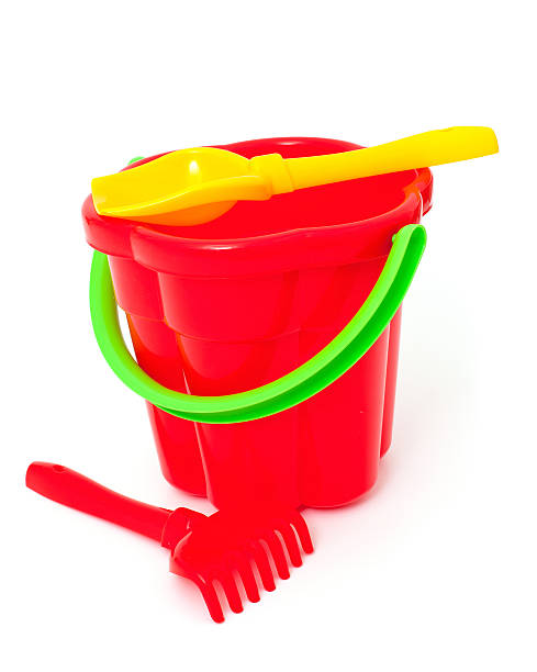 istock play set with bucket, shovel and rake on white 579409496