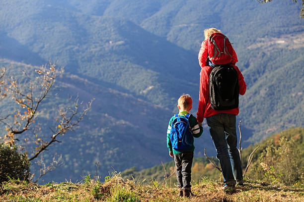 istock father with two kids travel in mountains 579410388
