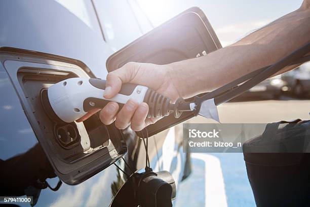 Electric Car Charging Stock Photo - Download Image Now - Electric Vehicle Charging Station, Electricity, Futuristic