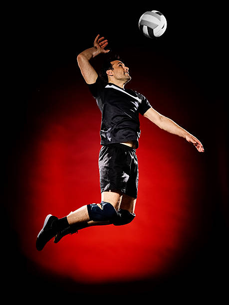 ボレーボールプレーヤーの男孤立 - volleying sport indoors action ストックフォトと画像