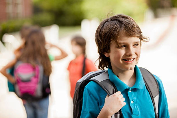 istock Back to School:  Elementary-age children, friends on school campus. 579414474