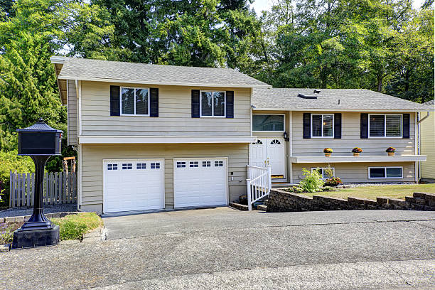 istock Beige siding  house exterior with white trim. 579415702