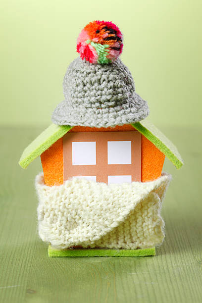 little house with knitted scarf and cap