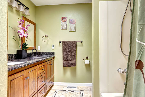 istock Cozy bathroom interior in ivory tones with orchid pot 579416636