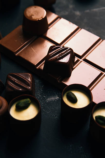istock Many chocolate sweets with  Pistachio on black background 579416794