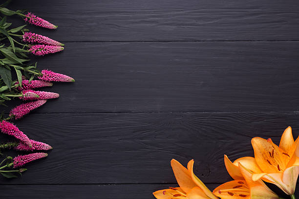 istock frame of flowers, background black boards 579417278