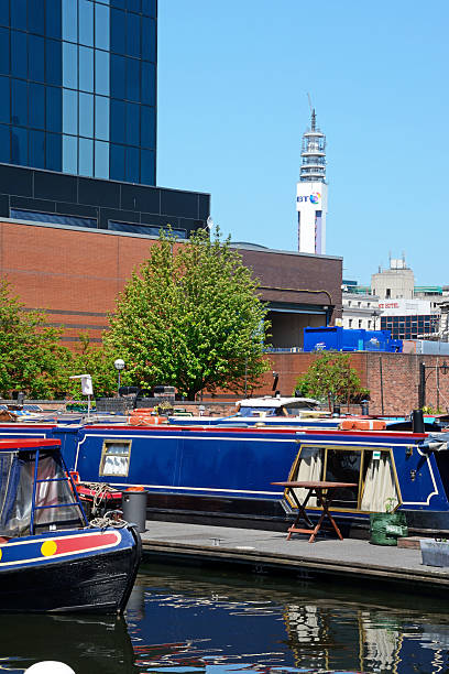 Boats in Gas Street Basin, Birmingham. Birmingham, United Kingdom - June 6, 2016: Narrowboats at Gas Street Basin with the BT tower to the rear, Birmingham, England, UK, Western Europe. british telecom photos stock pictures, royalty-free photos & images