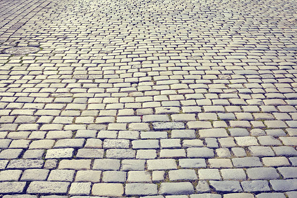 istock Vintage toned cobblestone street. 579417770