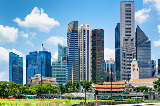 Singapore, Singapore - March 1, 2016: Skyline with One Raffles Place and UOB Building with Victoria Theater and concert Hall in Singapore