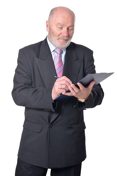 istock Elderly  businessman with clipboard 579418138