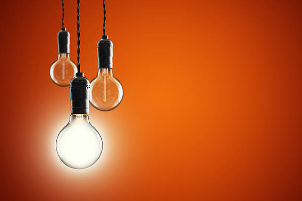 istock Idea and leadership concept Vintage incandescent Edison bulbs on 579420538
